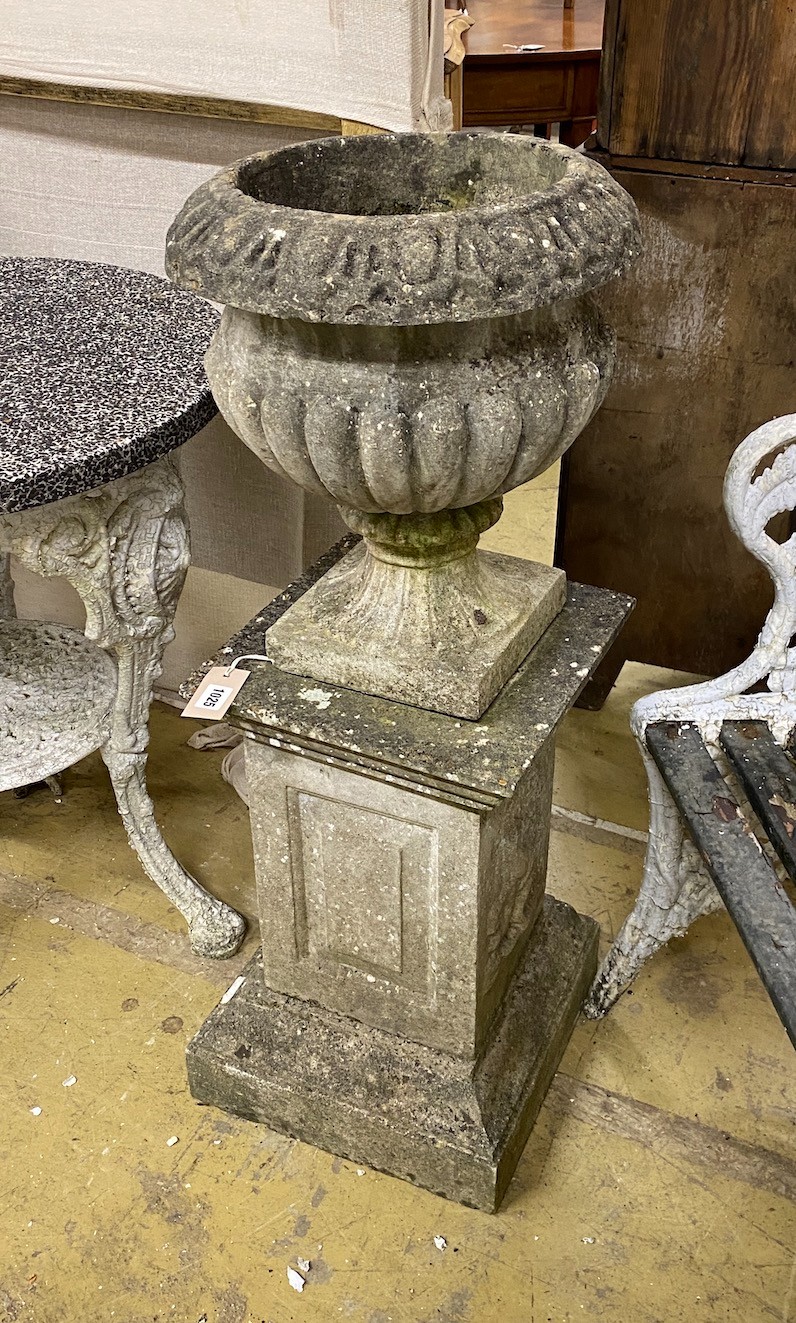 A circular reconstituted stone campana garden urn on square pedestal, height 95cm